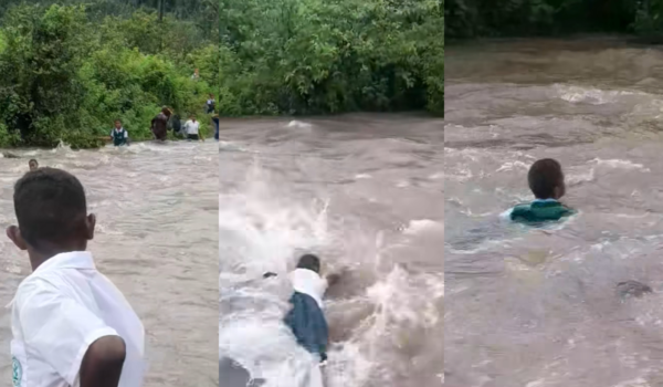 School Kids Brave Flooded Waters to Reach School