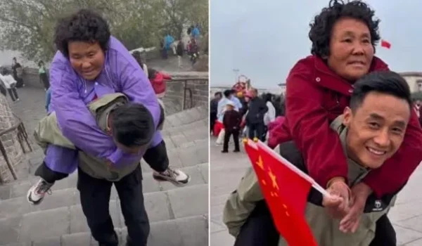 Man Carries Paralyzed Mother As They Travel Through China.